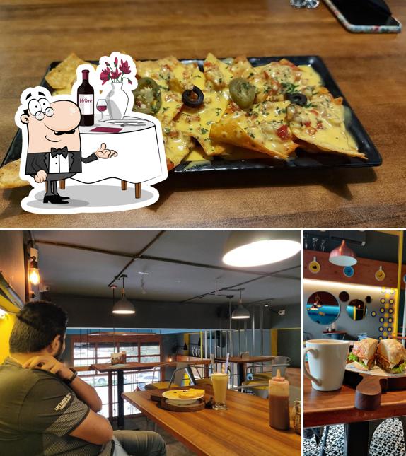 Check out the image displaying dining table and pizza at Crazy Cheesy Cafe Warje