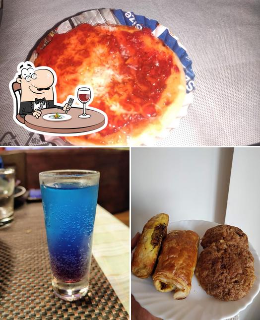 The picture of food and beer at Bombay Bakery