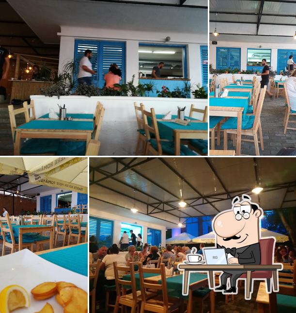 Посмотрите на внутренний интерьер "Santorini Taverna"