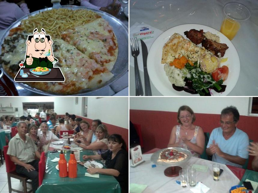 O Figaro's Pizzaria e Restaurante se destaca pelo comida e mesa de jantar