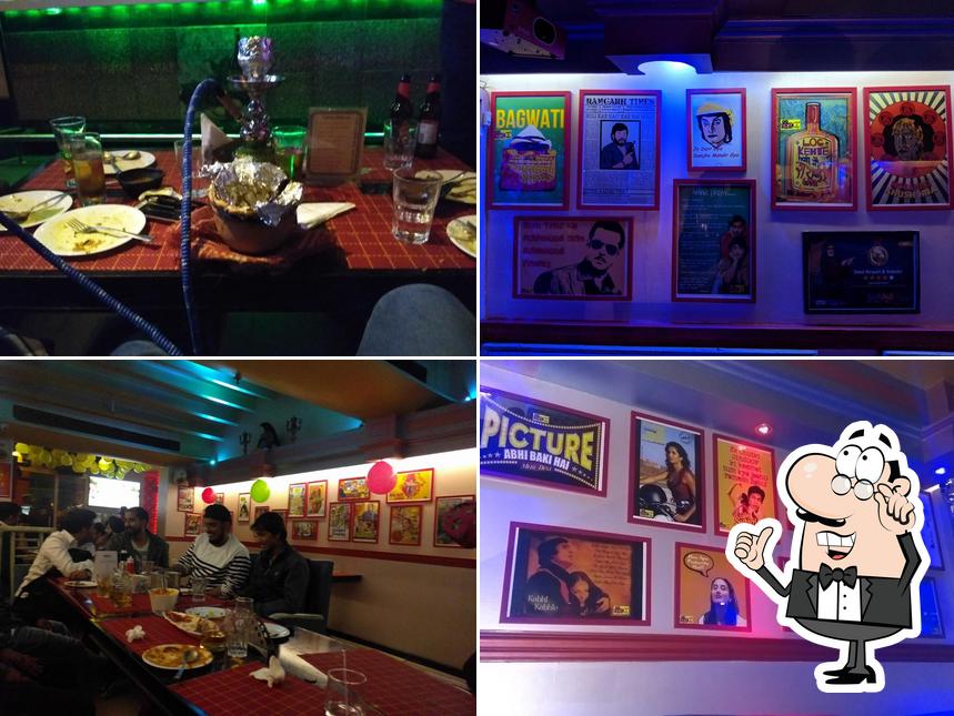 Take a seat at one of the tables at Filmy Cafe & Bar