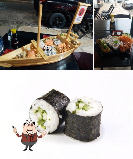 A foto da comida e mesa de jantar no Sushihousepiri