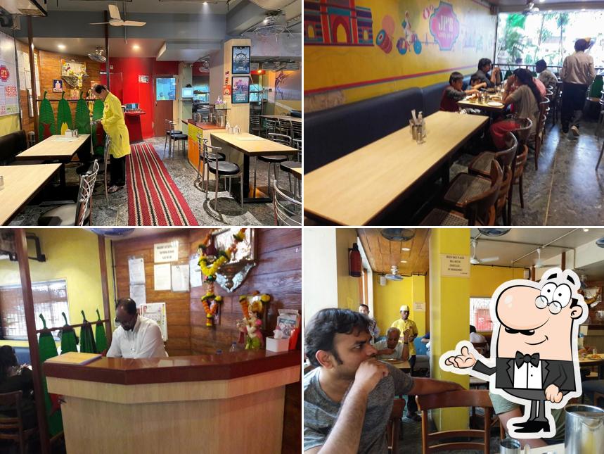 Take a seat at one of the tables at JP's Lunch Home / Mast Malwani n mangalorean coastal