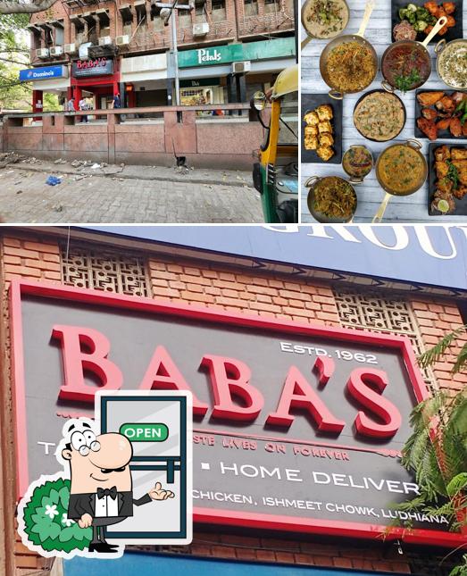 Take a look at the picture showing exterior and pizza at Baba’s(Baba Chicken), Defence Colony