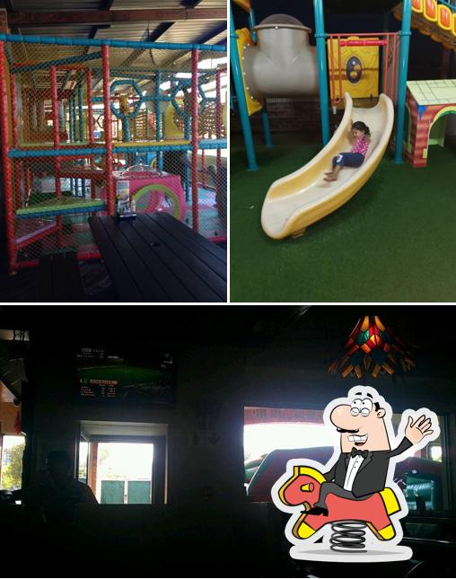 Check out the picture depicting play area and interior at Indigo Spur Steak Ranch