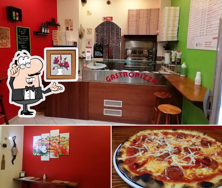 La foto di interni e pizza da Gastropizza