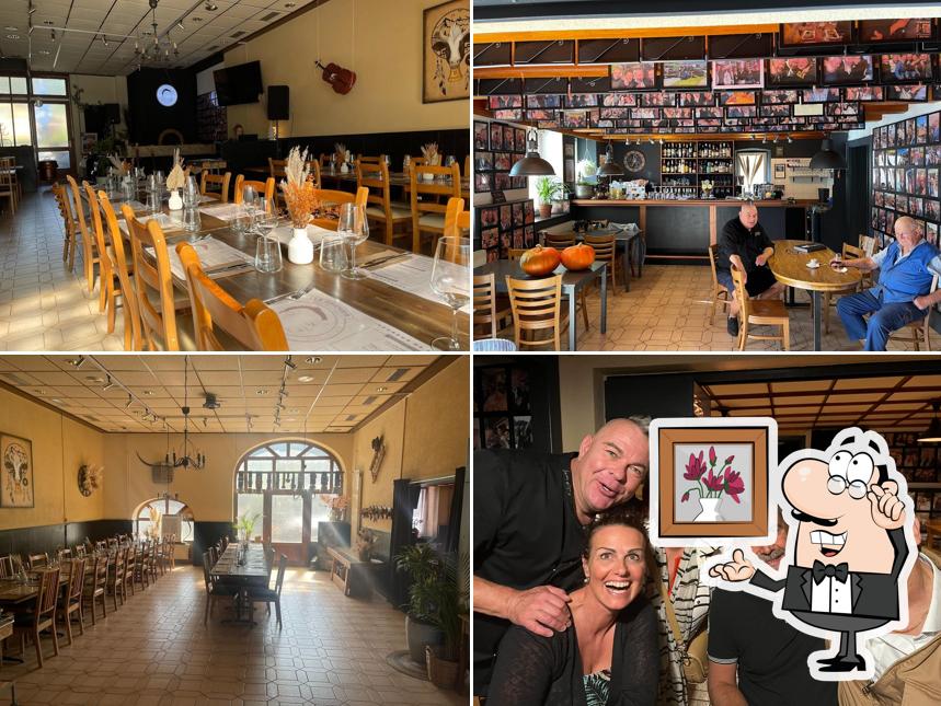 Siediti a un tavolo di Restaurant Le Grenier