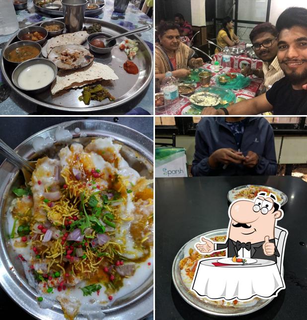 Satkar Restaurant is distinguished by dining table and food