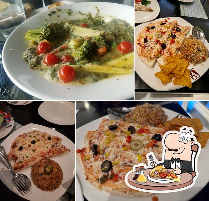 Try out pizza at Cloud 9 ( Rooftop Restaurant)