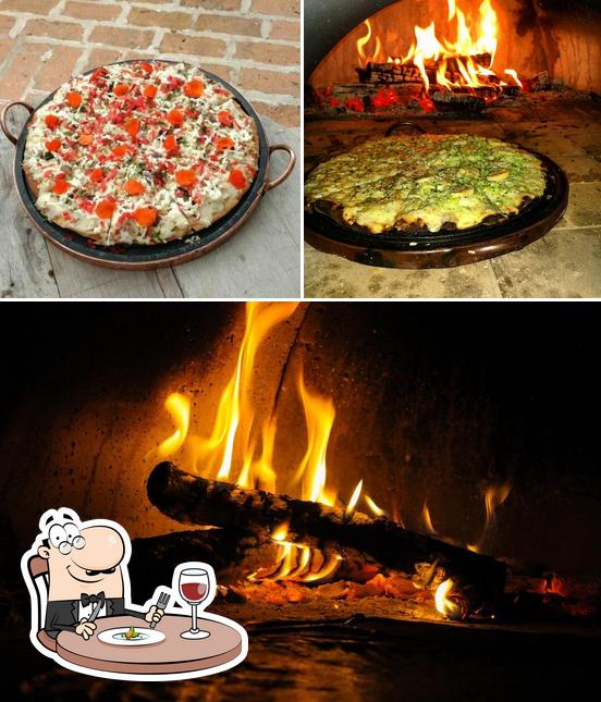 Esta é a foto ilustrando comida e interior a Pizzaria Esquina da Pizza