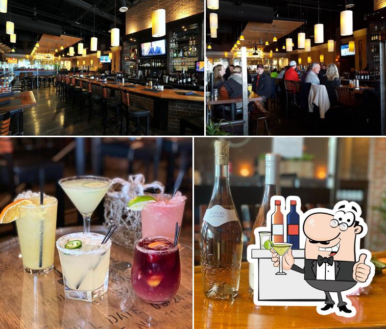 The photo of bar counter and drink at GrillMarx Steakhouse & Raw Bar