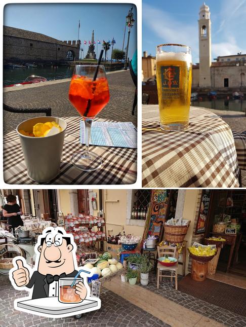Dai un’occhiata alla foto che presenta la bevanda e esterno di GIPI'S BAR