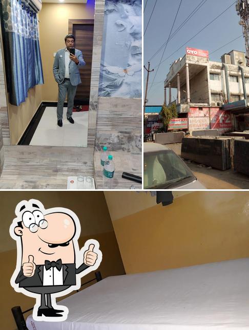 Look at the photo of Hotel Swastik