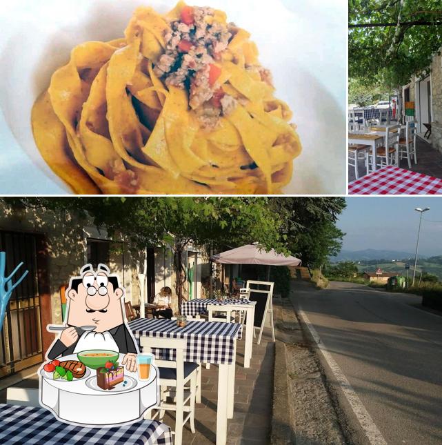 La foto di tavolo da pranzo e cibo da Antica Trattoria Guidetti - Osteria a Reggio Emilia