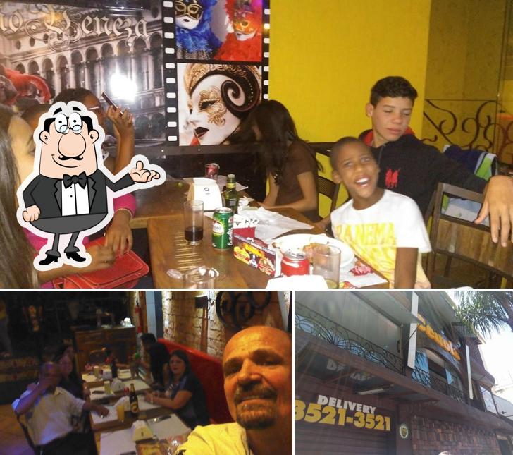 Dê uma olhada a imagem ilustrando interior e exterior a Pizza Scuola