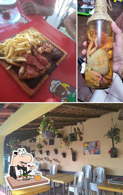 Esta é a ilustração apresentando comida e interior a Restaurante Lá no Jorge - Santa Bárbara