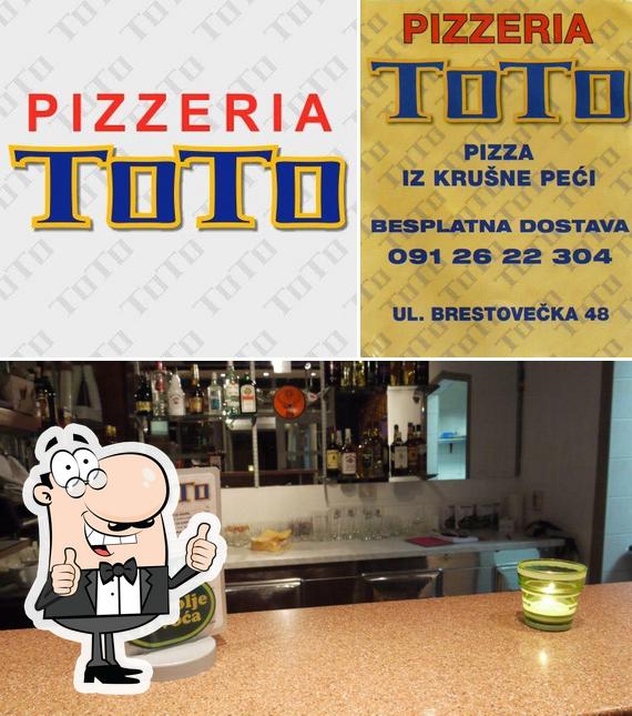 Look at this photo of Pizzeria TOTO