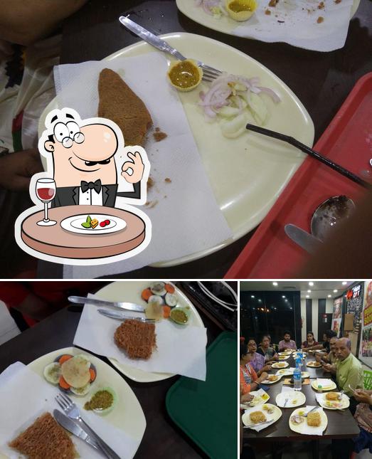 This is the picture showing food and dining table at Mitra Cafe