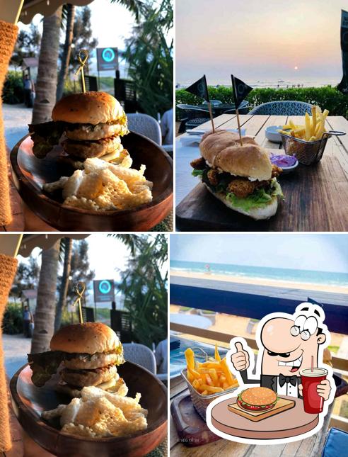 Order a burger at Poseidon's Cove Beach Grill - Planet Hollywood Goa
