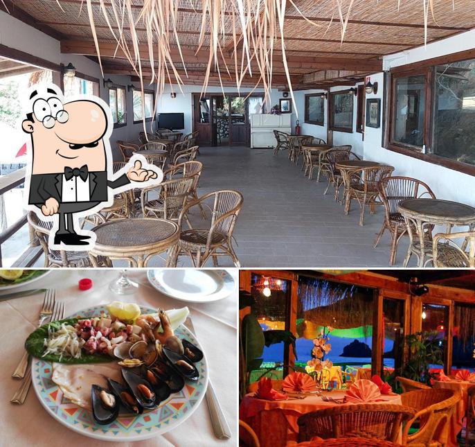 Questa è la immagine che mostra la interni e cibo di El Sombrero Spiaggia delle Bambole