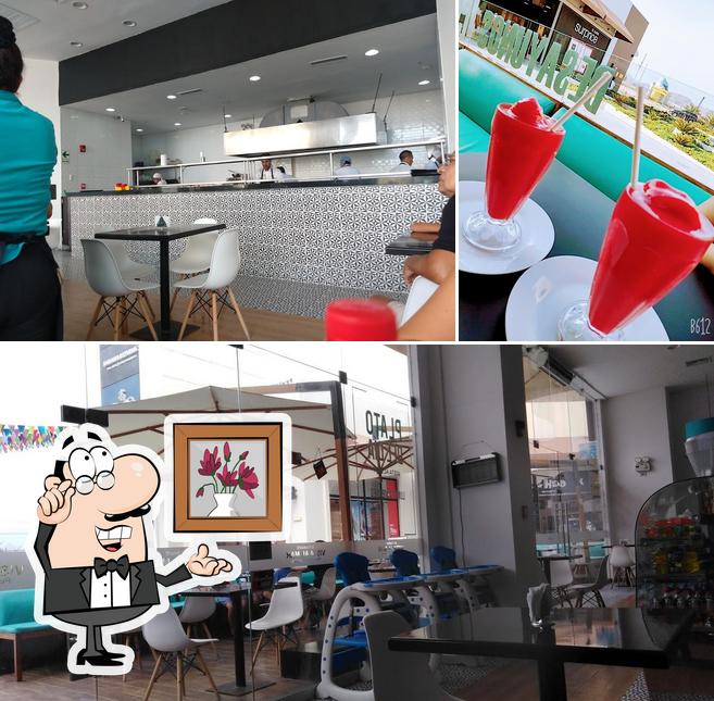 Check out the image displaying interior and beverage at Restaurante Vista Al Mar