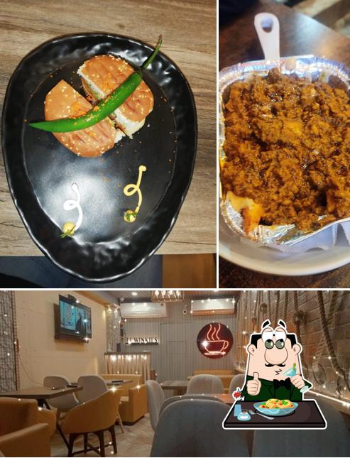 Check out the picture displaying food and interior at Le winkies