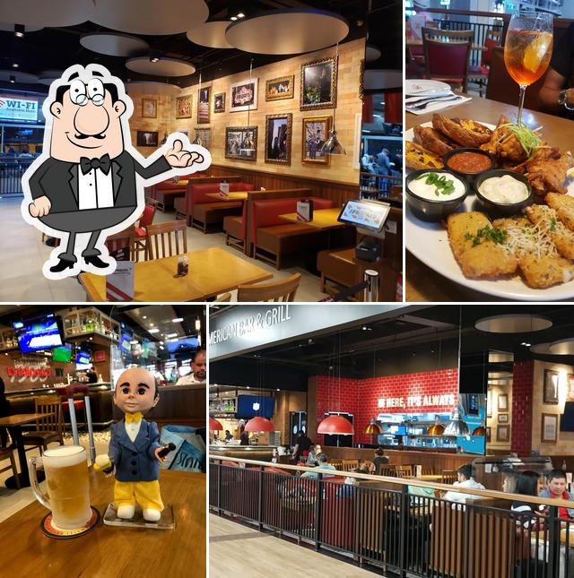 O interior do TGI Fridays T2 Check-In E: Sports Bar, Drinks, Hambúrguer, Happy Hour, Guarulhos SP