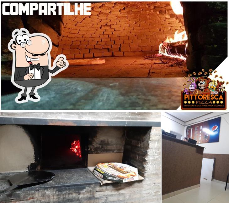 O interior do Pizzaria Pittoresca