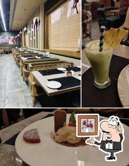 Take a seat at one of the tables at The Bliss Cuisine & Libations, Fine Dine