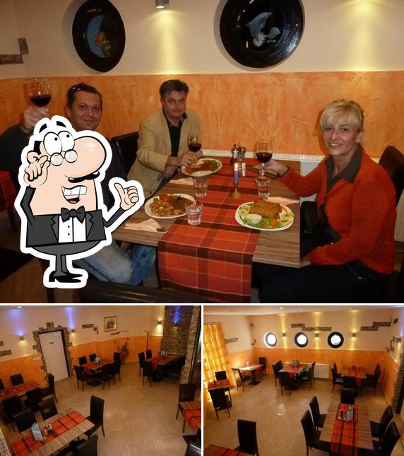 Dai un'occhiata agli interni di Ribji Bistro, restavracija z morsko hrano