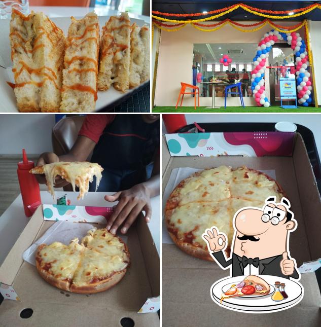 Get pizza at Nandini Cafe Moo