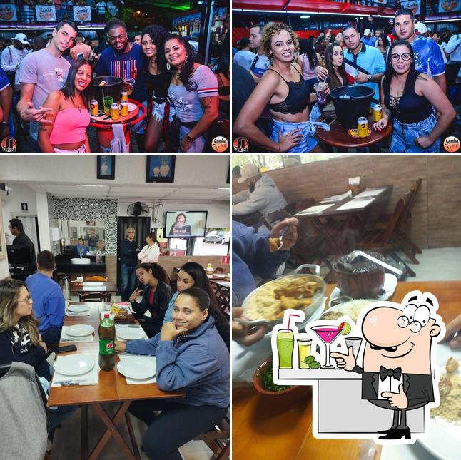 Confira a imagem ilustrando balcão de bar e mesa de jantar no Bar da Nê