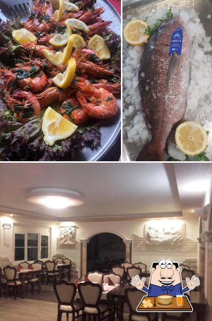 Parmi les diverses choses de la nourriture et la intérieur, une personne peut trouver sur Griechisches Spezialitäten Restaurant Delphi