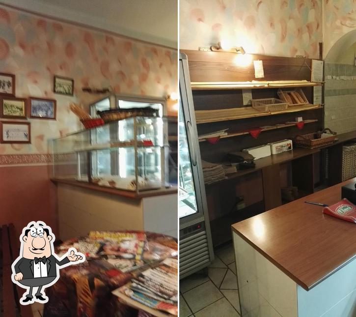 Dai un'occhiata agli interni di Qui & là pizzeria d'asporto