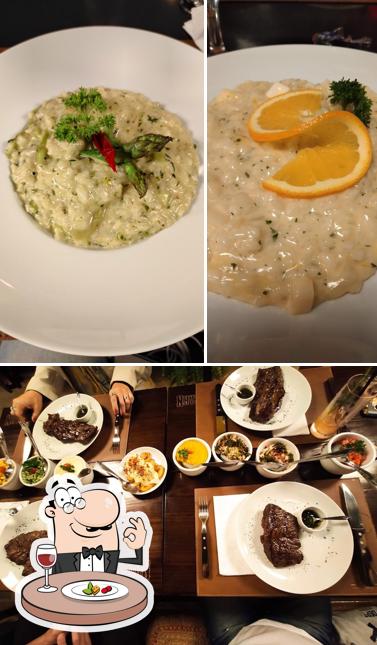 Esta é a foto mostrando comida e mesa de jantar a Azo Parrilla Contemporânea