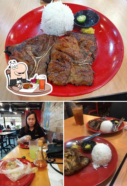 This is the photo displaying dining table and food at Ribshack