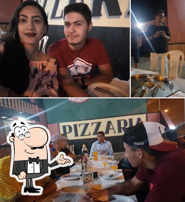 O interior do PIZZARIA SABOR DA HORA