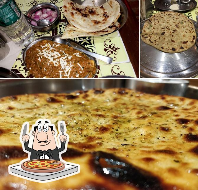 Try out pizza at Bharawan Da Dhaba