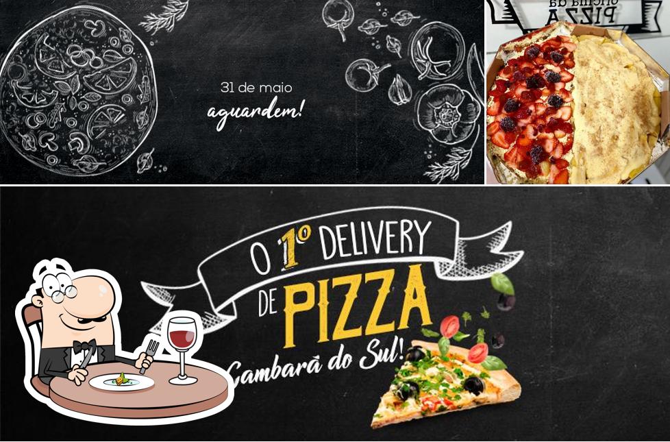 A foto do Oficina da Pizza Delivery Cambará RS’s comida e quadro-negro