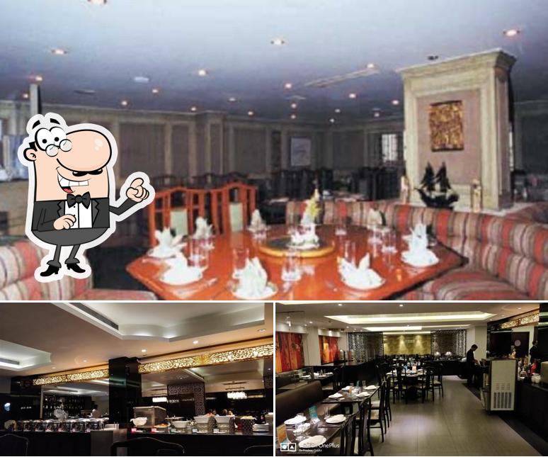 Take a seat at one of the tables at Mainland China Ashok Nagar