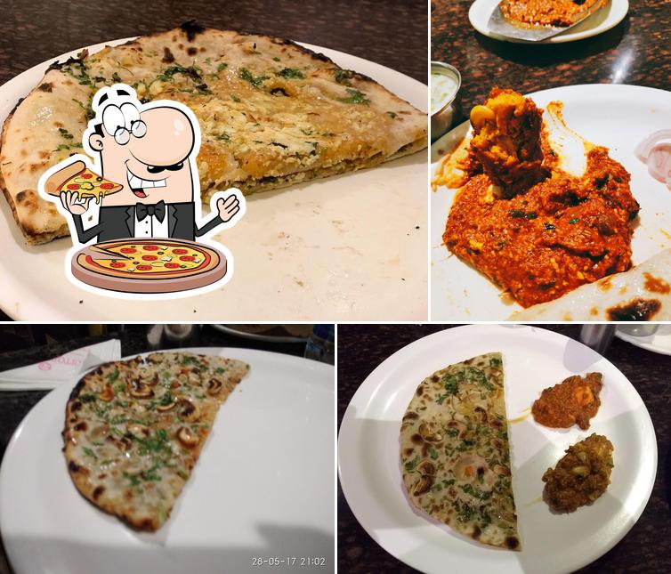 Get pizza at Santosh Dhaba Exclusive