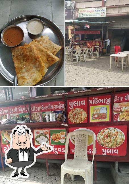 Among different things one can find interior and food at Shree yogi fast food and masala dosa