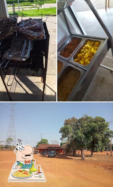 Entre diferentes coisas, comida e exterior podem ser encontrados no Restaurante e distribuidora Bar Dos amigos