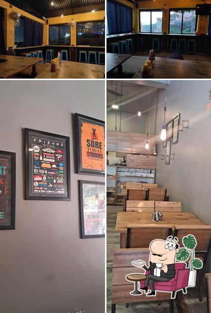 Take a seat at one of the tables at Cafe Shalom Rishikesh