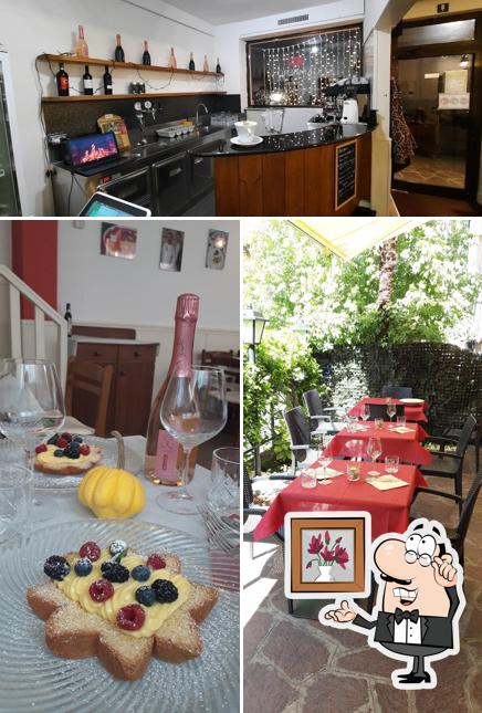Tra le diverse cose da Ristorante Gambero Bolzano si possono trovare la interni e tavolo da pranzo