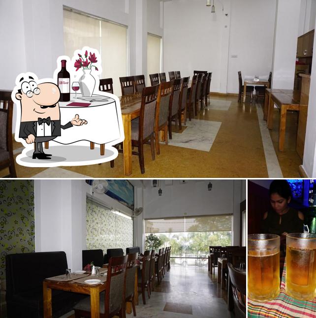 The photo of dining table and beer at Pal Haveli - Best Hotel in paonta Sahib