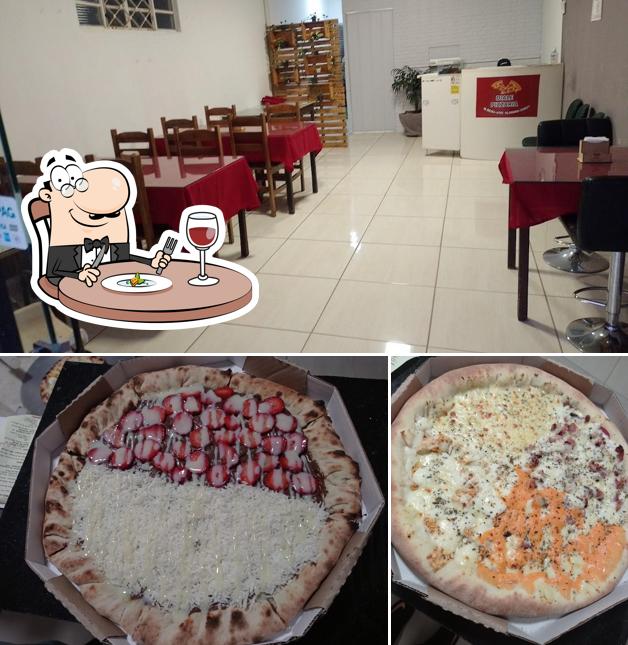 Esta é a foto mostrando comida e interior a Dialle Pizzaria