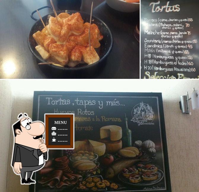 The image of blackboard and food at La Barraca Valenciana