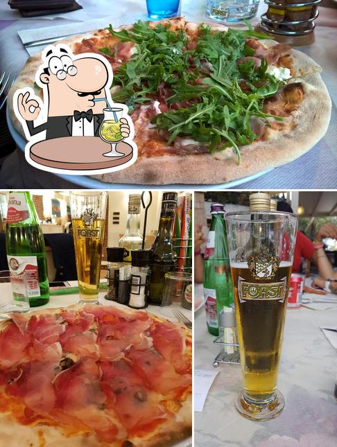 Questa è la foto che mostra la bevanda e pizza di Tavernetta Ristorante Pizzeria & Albergo