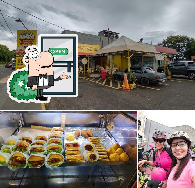 A foto do Empório Saída Lanchonete e Restaurante’s exterior e cidadãos